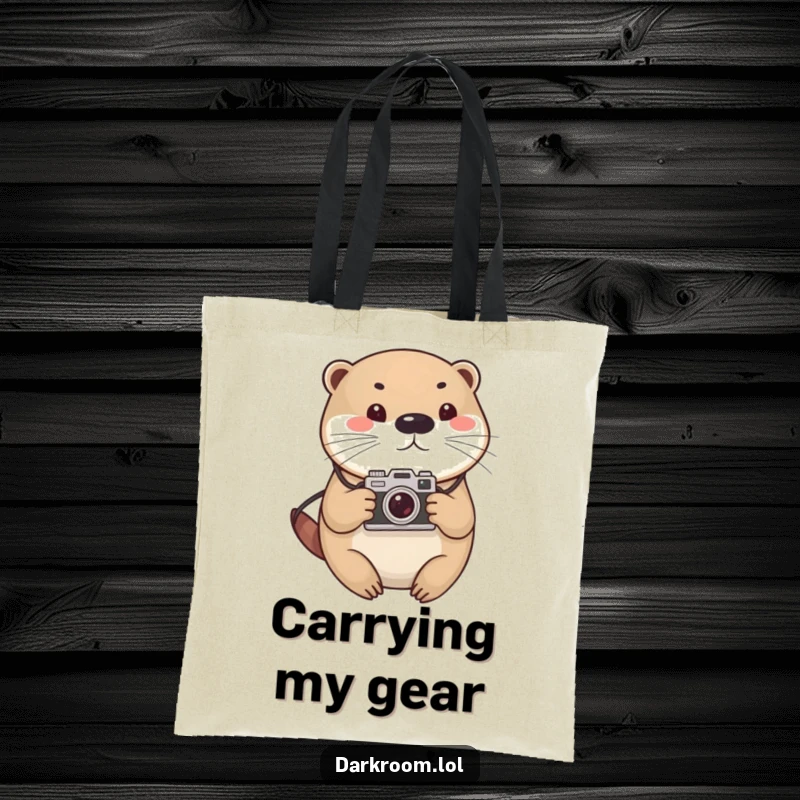 Funny otter photographer tote bag, cute and round, holding a vintage camera, perfect for carrying photography accessories with flair.
